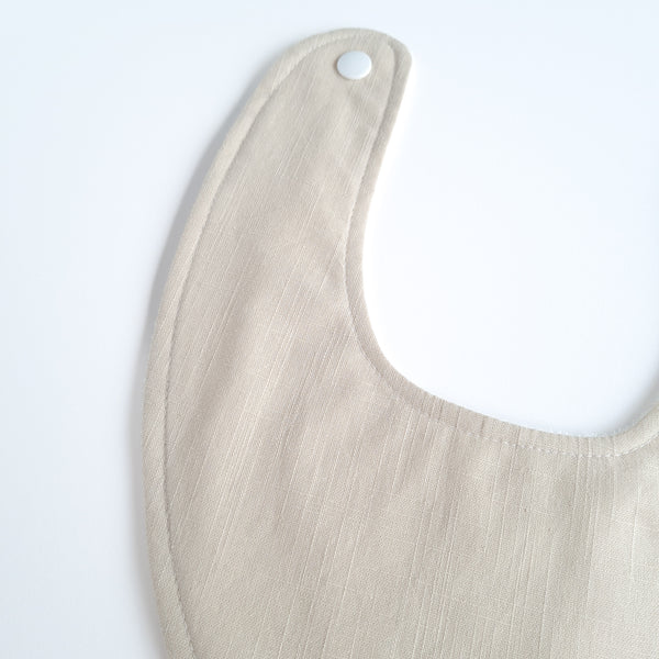 Beige dribble bib